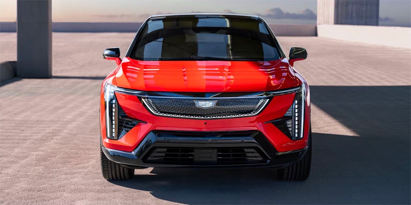 A red Cadillac parked front view